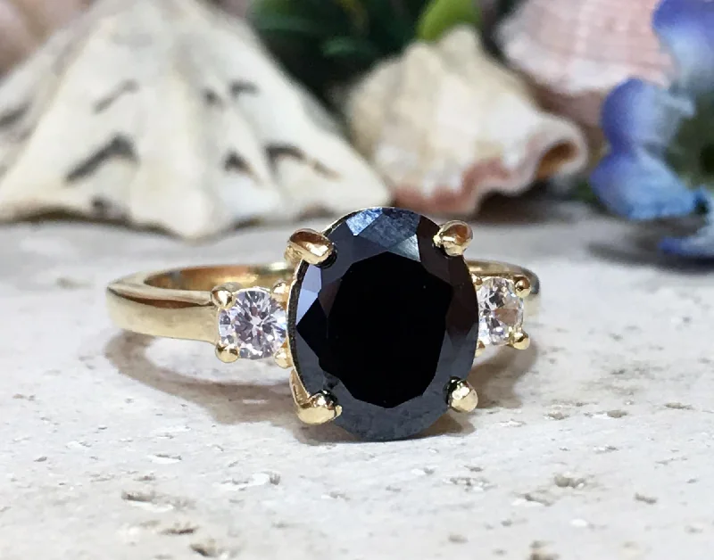 Topaz Gemstone Rings in 10K Gold with a Channel - Set Design for a Contemporary and Durable OptionBlack Onyx Ring - December Birthstone - Statement Engagement Ring with Oval Black Onyx Gemstone and Clear Quartz Accents