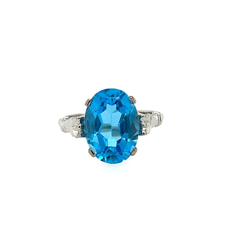 Women's Diamond Rings with Opal Inlays and Diamond Accents for a Mysterious and Iridescent Look18ct White Gold 7.62ct Oval Blue Topaz Dress Ring