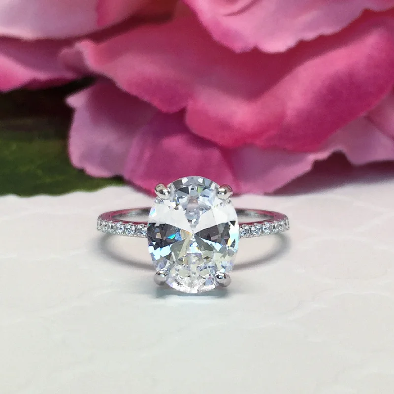 Oval Cut Engagement Rings in Palladium with a Hidden Halo for a Surprise Sparkle3.25 ctw Oval Accented Solitaire Ring - 10k Solid White Gold