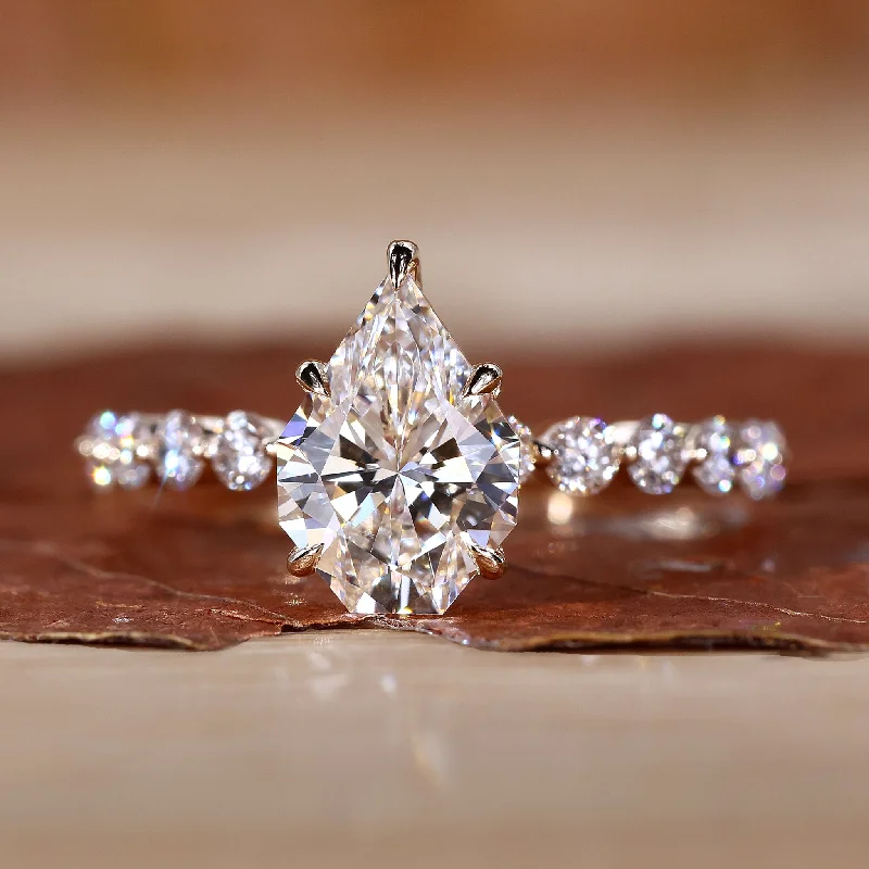 Marquise Cut Engagement Rings with a Channel - Set Diamond BandEngagement Ring Gold with a Sparkling Spear Cut Diamond