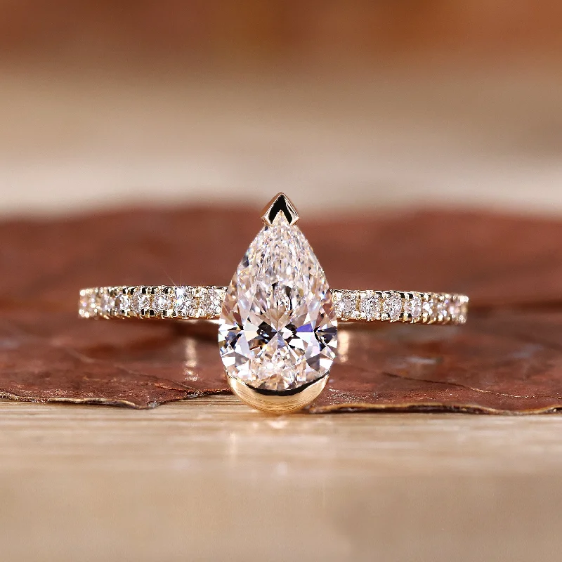 Adjustable Engagement Rings with a Flexible Band and a Princess - Cut Center DiamondPear Shaped Ring In A Half Bezel Setting By Expert Ring Designer